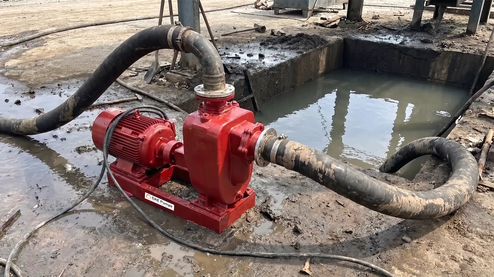 Self-Priming Pump Sizing DAE Pumps electric self-priming pump with hoses drawing from a muddy sump
